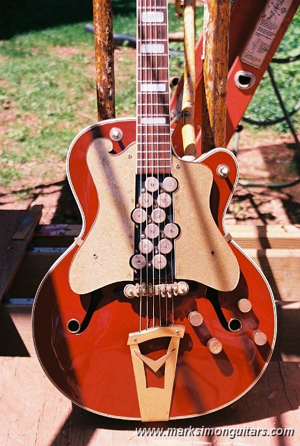 R1-02043-016A.jpg - This guitar was designed to feed a pair of amplifiers for an on-stage stereo effect and the electronics are very prototypical in appearance. Notice the Gretsch "Melita" bridge, Gretsch style knobs, and tailpiece.